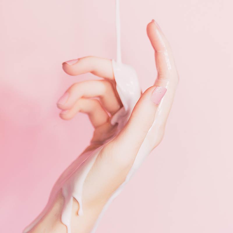 Lotion Dripping Down a Hand